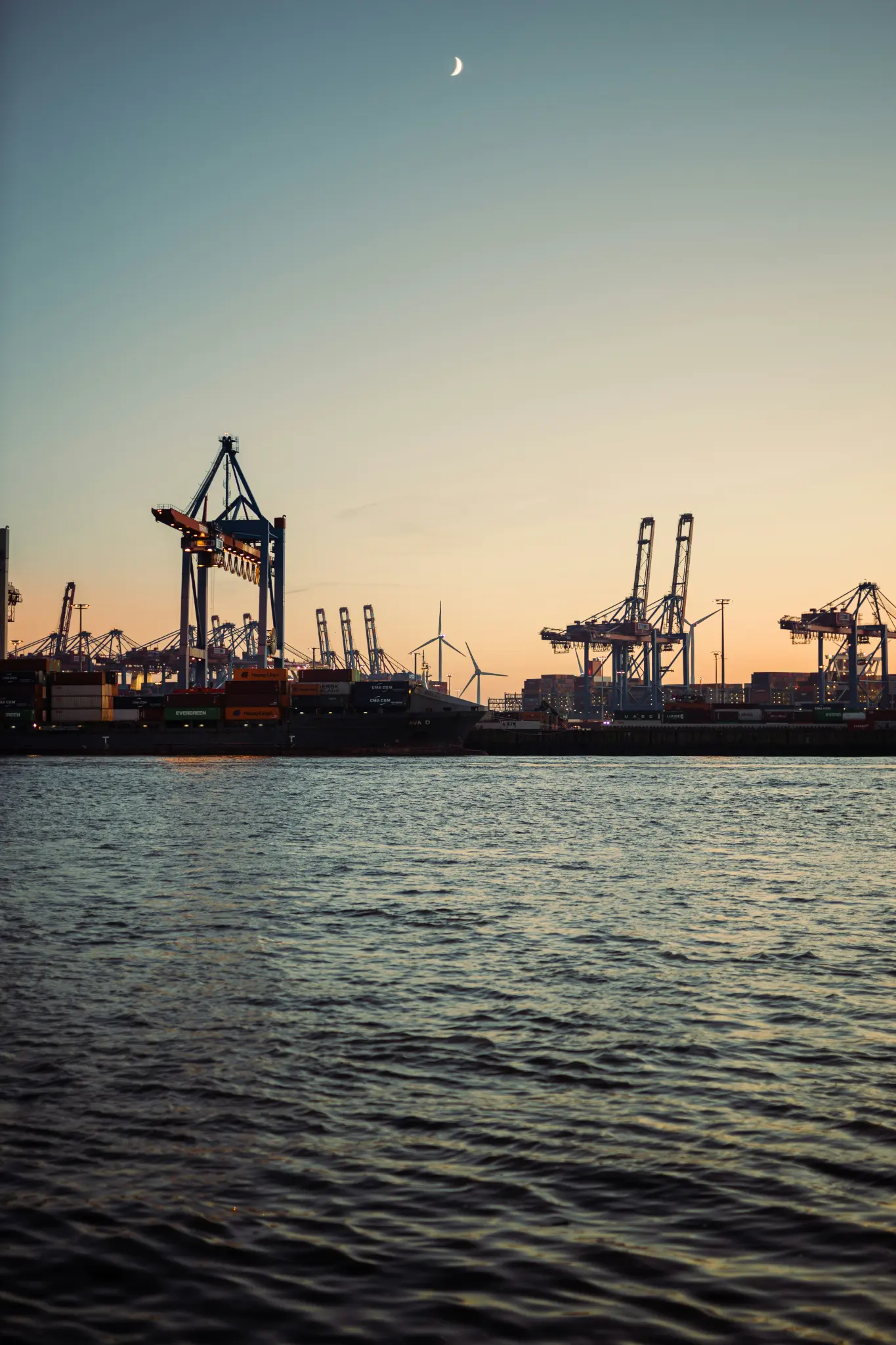 Commercial port and harbour infrastructure at dusk